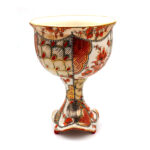 Just A Little Tipsy (#1) | 2024 | h 5.75″ x d 4″ | Porcelain, Glaze, Overglaze, 24k Gold Luster, Orange Luster, Platinum Transfers, Vintage Flower Decals